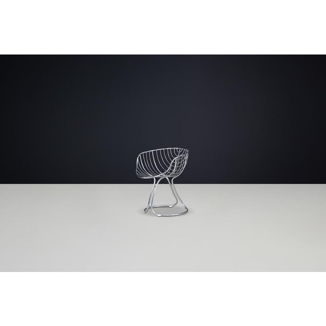 Gastone Rinaldi designed the "Pan Am" dining chair or armchair for Rima Padova around 1970. It features a structure made...