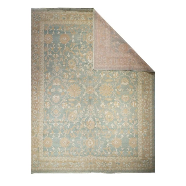 This recent west Turkish workshop carpet in a coarse weave, show an abrashed jade green field with a well-spaced allover,...