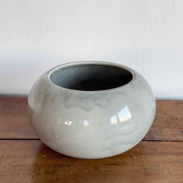 Vintage pale blue glazed ceramic planter bowl. Stamped Washburn USA on bottom. Dimensions Width: 8" Height: 4.75"