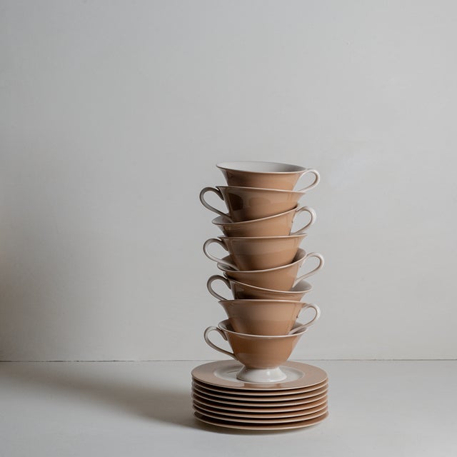 Sleek, soft lines and understated brown and ecru glaze makes this set of eight tea cups and saucers irresistible.