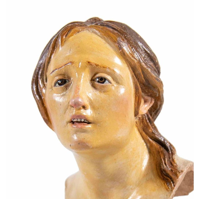Head of woman man is a splendid sculpture realized in polychrome ceramic with glass eyes. Neaples, 18th Century. Very rare...