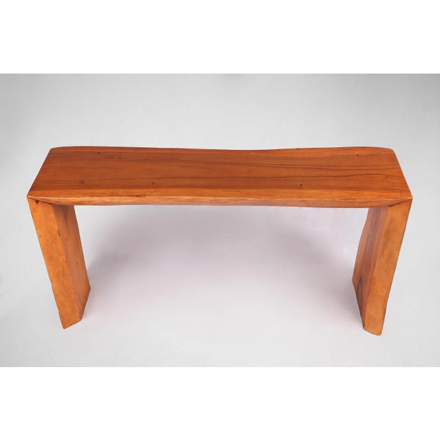 Almost straight cut top and living edge legs, this contemporary console table displays a clean, graceful, modernist...