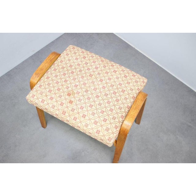 A charming original Jitona upholstered footstool from Czechoslovakia, dating to the 1960s. The stool features a...