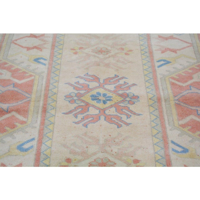 Hand-knotted with care using traditional rug-making techniques, this wool rug blends timeless craftsmanship with a modern...