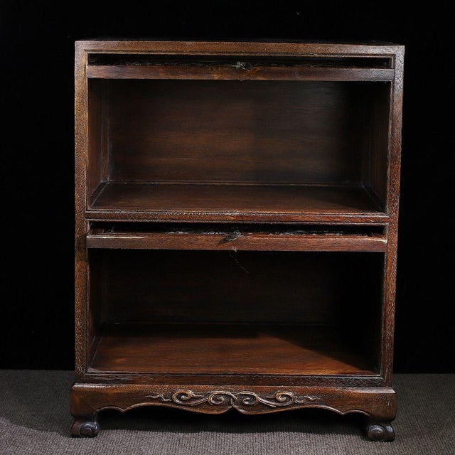 This is a beautifully crafted vintage display cabinet or storage unit, made from rosewood (huali wood) with a rich, warm...
