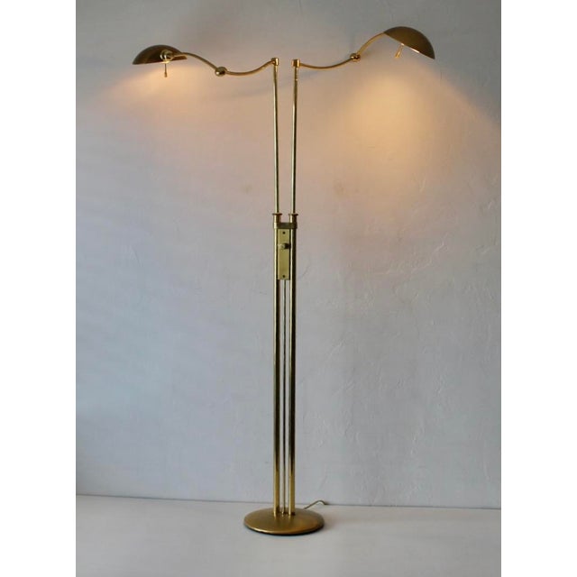 A vintage postmodern brushed gold/brass Holtkoetter Leuchten German two-light brass floor lamp. Twin articulating swing...