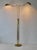 A vintage postmodern brushed gold/brass Holtkoetter Leuchten German two-light brass floor lamp. Twin articulating swing...