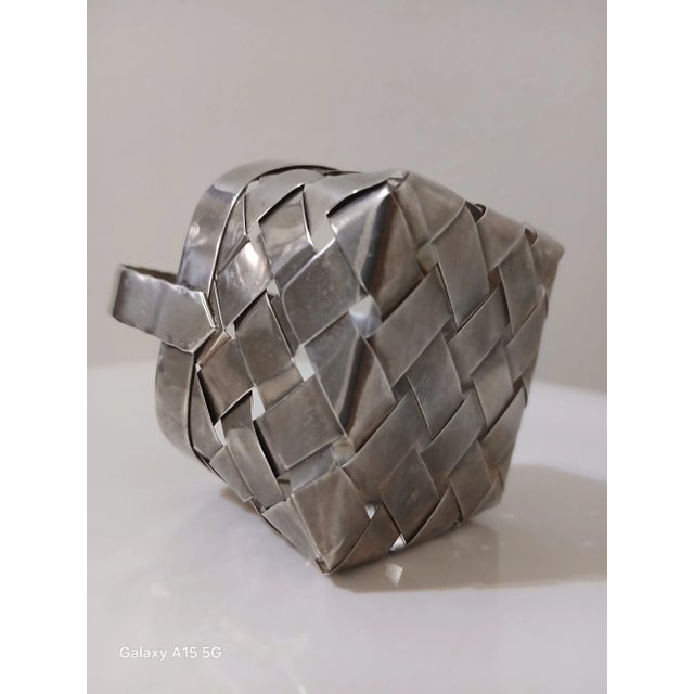 Cartier sterling silver hand woven basket. This little basket is in excellent condition, with no dents. It's approx 3.1" h...