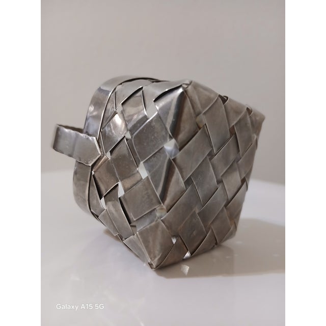 Cartier sterling silver hand woven basket. This little basket is in excellent condition, with no dents. It's approx 3.1" h...