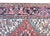 This early 20th-century Persian Heriz rug is a masterful example of the iconic craftsmanship from the Heriz region in...