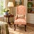 An unusually tall, slender Queen Anne–style wing chair: just 22" wide but 45" high. The narrow footprint suits smaller...
