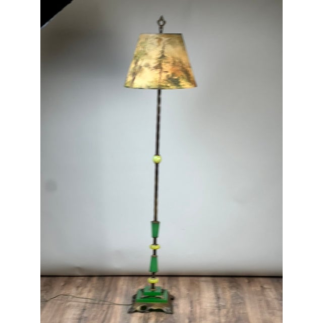 This unusual and highly decorative antique floor lamp beautifully captures the playful geometric styling and vibrant...