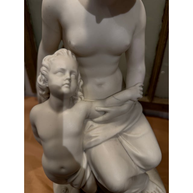 This is a bisque figure that depicts a woman and child. It is incredibly detailed. This is porcelain biscuit. This piece...