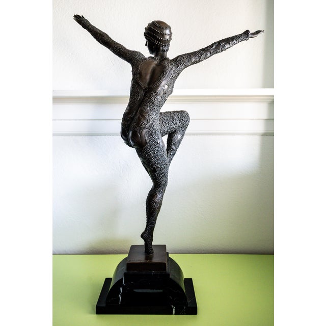 An exceptional and monumental Art Deco bronze dancer sculpture, executed after the celebrated designs of Demétre Haralamb...
