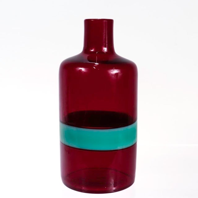 A fine Mid-Century Italian art glass bottle. A so-called 'a fasce orizzontali' bottle with a broad turquoise band in a...