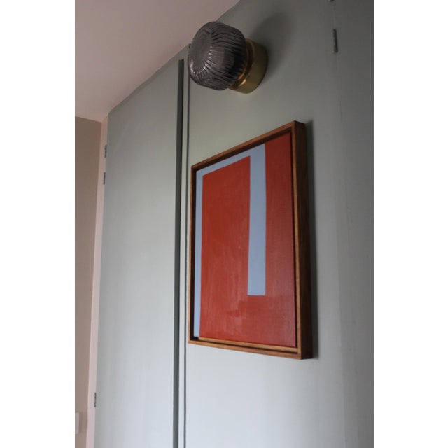 A composition reduced to its essence, where form, color, and space meet with serene precision. The contrast between a deep...