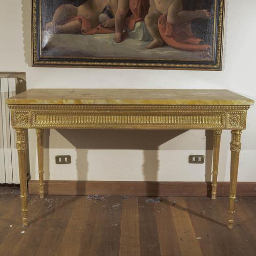 This imposing neoclassical console table is a refined example of antique furniture, ideal for adding a touch of nobility...