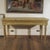 This imposing neoclassical console table is a refined example of antique furniture, ideal for adding a touch of nobility...