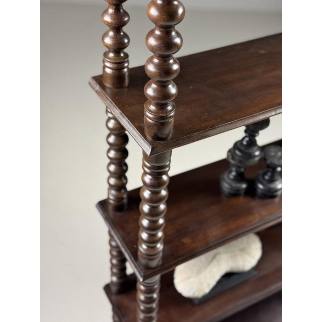 Bobbin bookcase/bookshelf. Originally from France. Early 20th century. Made of walnut. Stands on ball legs. In good...