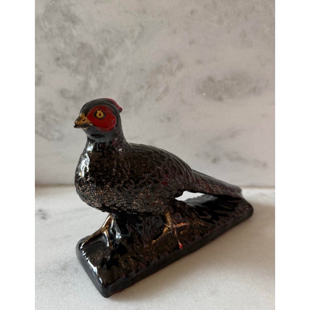 Vintage MCM ceramic pheasant figurine with glossy black finish and gold accents and red details on the face. Unmarked, but...