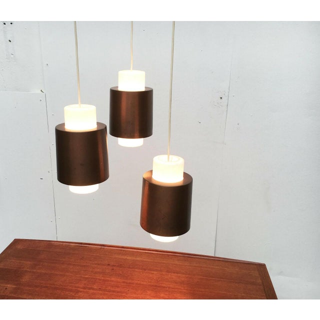 Rare mid-century cascade lamp from the renowned manufacturer staff leuchten. the cascade consists of three simple...