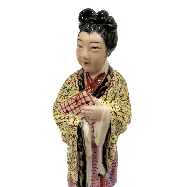 This object is a vintage Chinese Famille Rose porcelain figurine depicting a court lady or maiden dated from the Republic...