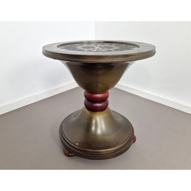 This Dutch Art Deco copper 'smokers table' has some great accents and curves. The top features a Mandala style flower...