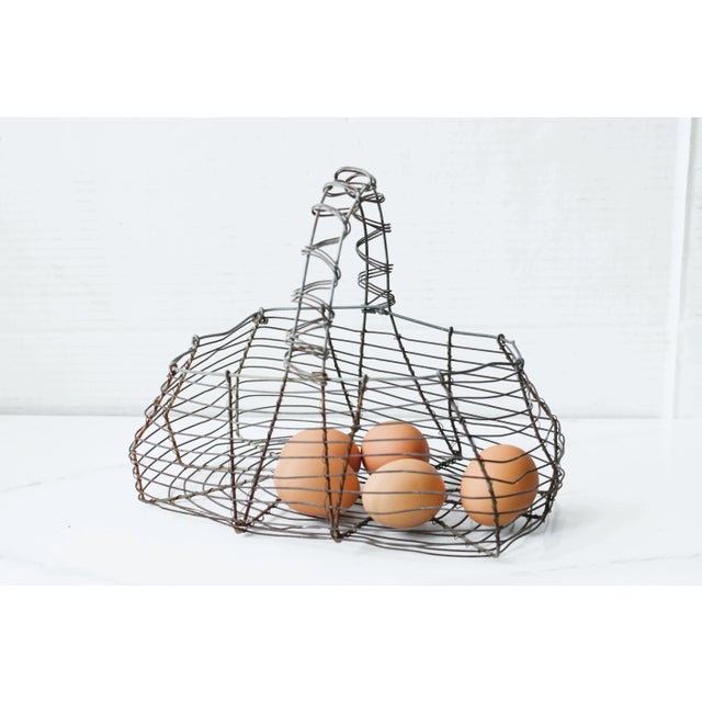 Vintage French egg basket made of hand twisted metal wire. Wonderful as a unique Easter Decor alternative. Shipping: We...