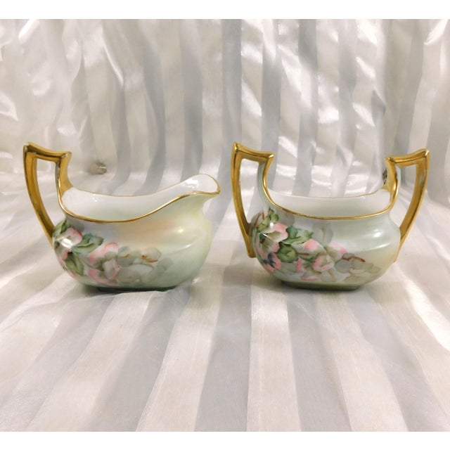 This is a set of a sugar bowl and creamer marked Classic Bavaria. The sugar bowl is signed on the base as shown. The set...