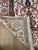 Finely hand-knotted vintage Turkish Hereke silk textile with a mihrab design and floral and botanical motifs. The silk has...