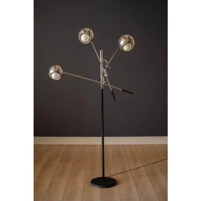 Vintage Triennale floor lamp designed by Robert Sonneman circa 1970's. This versatile piece features three adjustable...