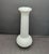Crafted in the United States, this vase showcases the smooth, opaque white finish that defines traditional milk glass. Its...