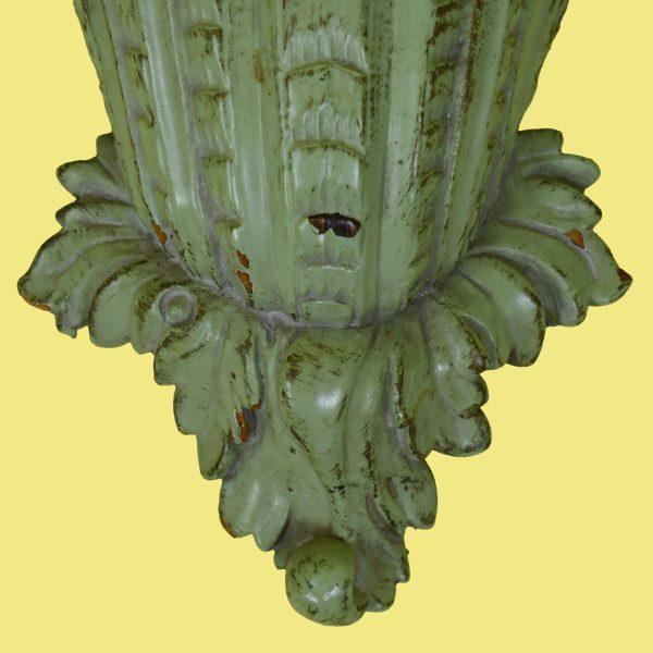 A pair of green ornamental brackets — carved and pierced wall brackets in a rich green finish with gilded accents. They...