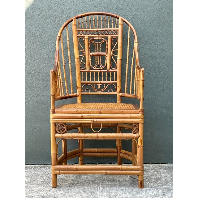 This stunning vintage armchair is a masterful interpretation of the iconic Brighton Pavilion aesthetic, blending Regency-...