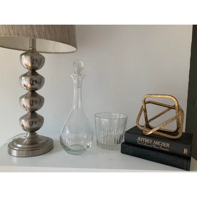 Decanter and ice bucket/chiller set. Etched with a matching floral pattern. Lovely crystal set to add to your bar. The ice...