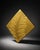 legant square wall plaque featuring a raised botanical leaf relief with a metallic gold finish. The textured surface gives...