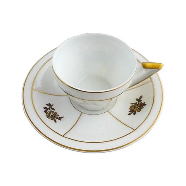 Vintage Set of five gilded, floral-decorated demitasse cups and saucers. Maker's mark reads "VA Portugal." Dimensions:...