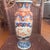 This is a 19th-century Japanese Imari porcelain vase from the Meiji period featuring hand-painted floral and bird designs...