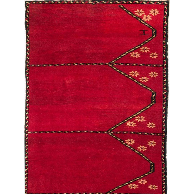 This mid-20th-century Turkish Anatolian long runner presents a striking series of elongated prayer-niche forms arranged...