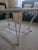 Beautifully hand-forged iron base topped with marble, featuring intricate scrollwork and acanthus leaf accents. The hand-...
