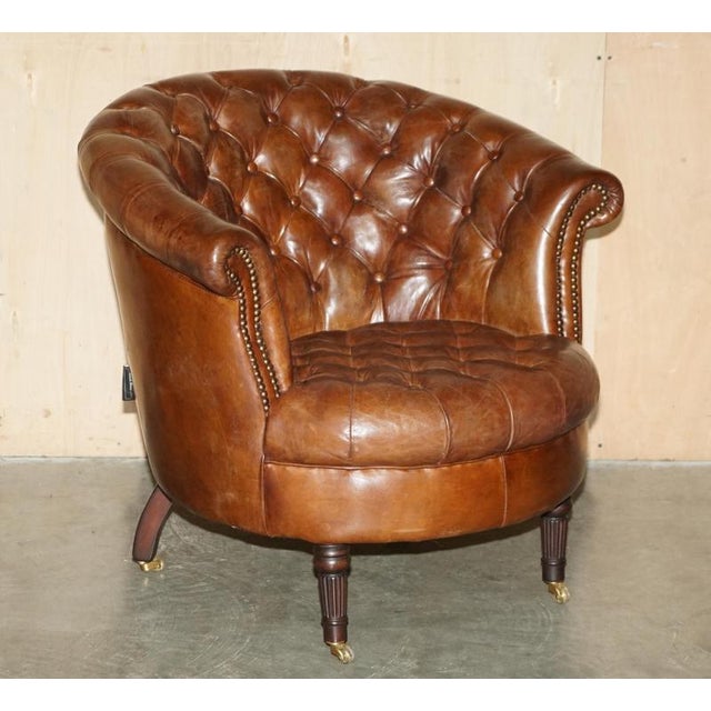 Lovely Chesterfield club tub armchair with coil sprung seat platform and fluted elegant legs finished with brass castors A...