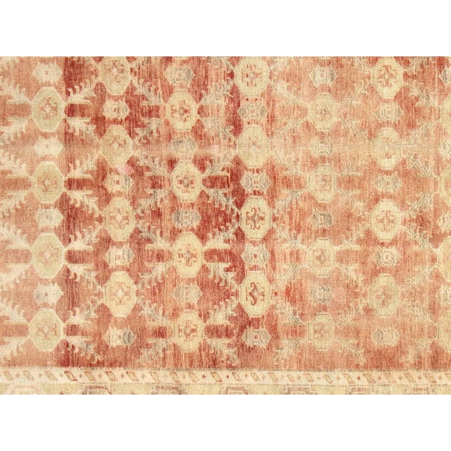 This beautiful vintage Turkish Oushak Rug is hand-knotted with 100% wool on a wool foundation to provide a soft, warm...