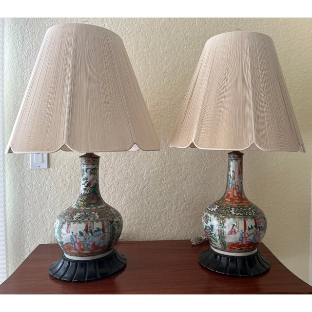 A set of handsome, large, hand-painted Chinese Rose Medallion porcelain table lamps. Two similar hand decorated Chinese...
