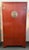 Design Plus Gallery presents a Red Lacquer Armoire of Chinese Influence. The tall armoire has the design of a wedding...