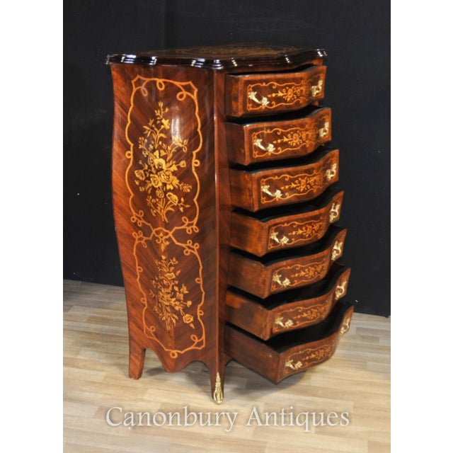 Elegant French Empire commode or tall boy of bombe form. Intricate marquetry inlay work on all sides showing floral...