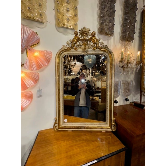 19th century French Louis Philippe carved and gilt mirror with cherubs. Circa 1870. Adds warmth and charm to any room! 32w...