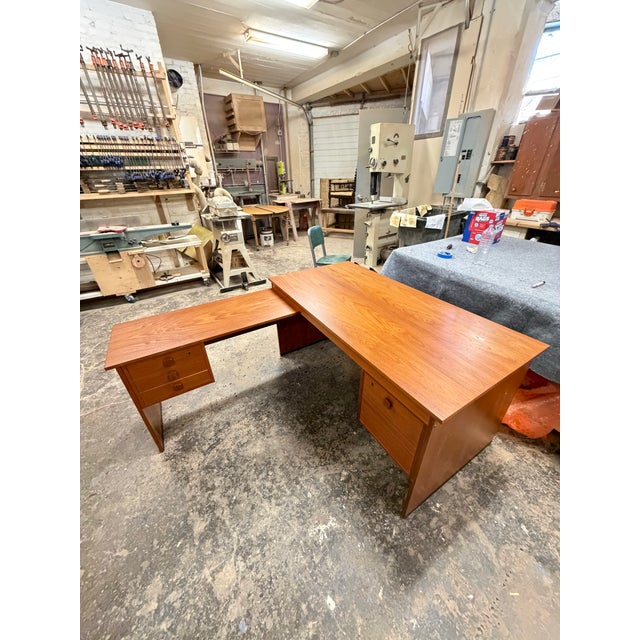Mid-century modern teak “L” desk. Everything has been refinished. L return has three small drawers, main desk has one big...