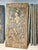 A striking hand-carved wooden panel from India, featuring intricately detailed relief carvings of Hindu deities, believed...
