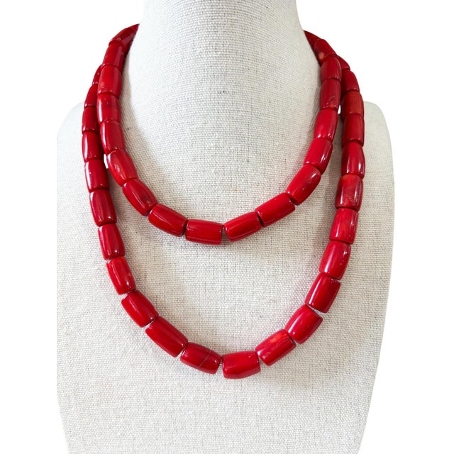Vintage Chunky natural red coral string featuring polished, graduated barrel-shaped drum beads. Each bead showcases the...