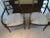 A Pair of Baker Chairs gold painted and Ebonized armchairs. The Chairs boast new upholstery with nailhead trim. Bakers...
